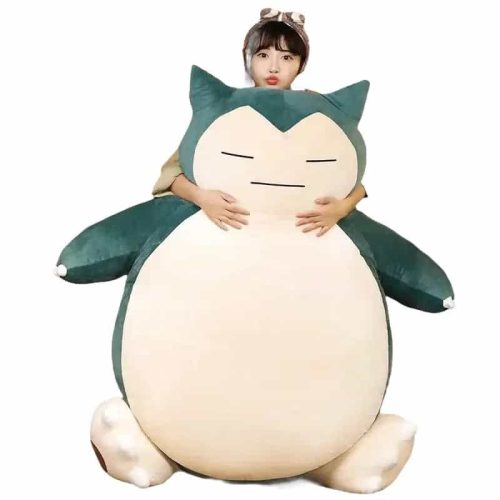 Peluche Ronflex géante rembourrée, avec un enfant pour l'échelle
